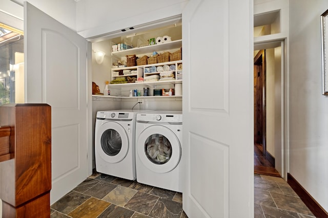 clothes washing area featuring independent washer and dryer