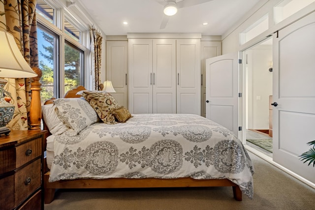 carpeted bedroom featuring ceiling fan