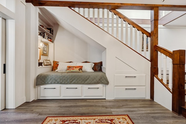 interior space featuring hardwood / wood-style floors and a high ceiling