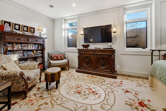 sitting room with ornamental molding