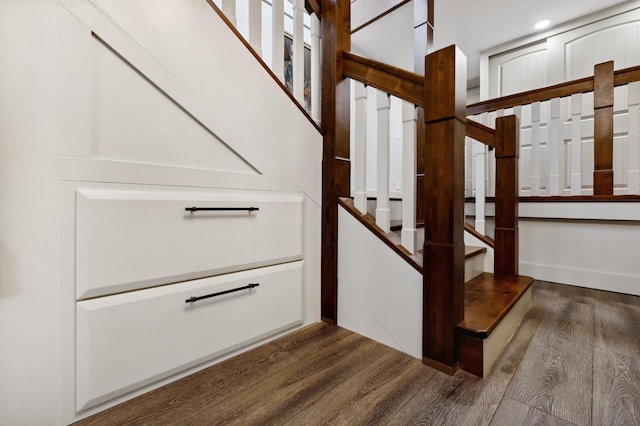 staircase featuring hardwood / wood-style flooring