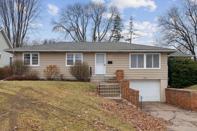 view of front of house featuring a garage and a front yard