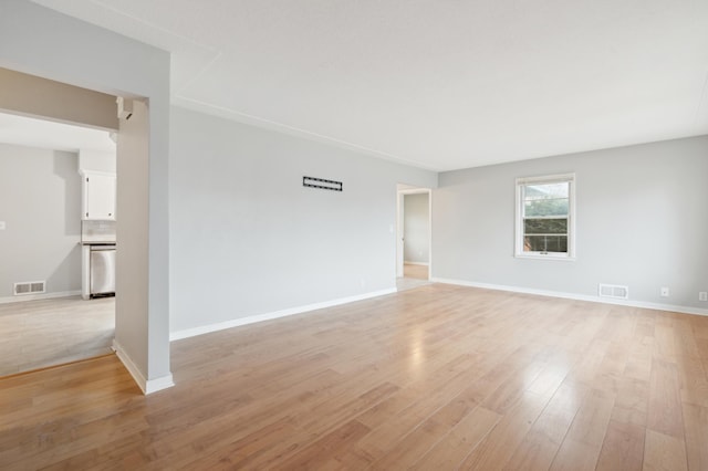 spare room featuring light wood-type flooring