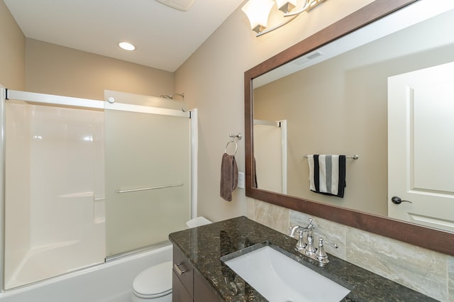 bathroom featuring decorative backsplash, enclosed tub / shower combo, toilet, vanity, and visible vents