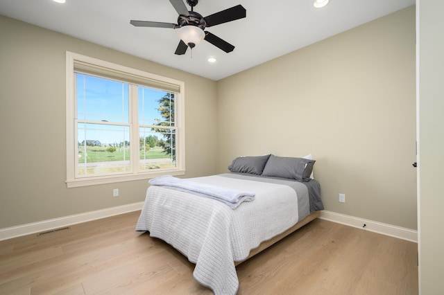 bedroom with visible vents, recessed lighting, light wood finished floors, and baseboards