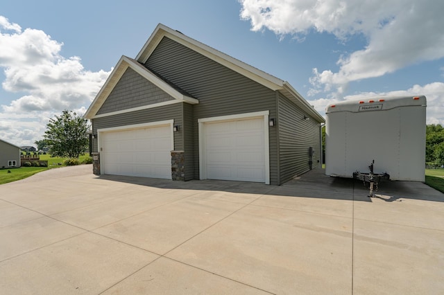view of side of property with driveway