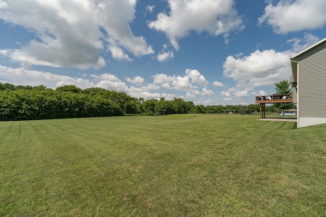view of yard with a wooden deck