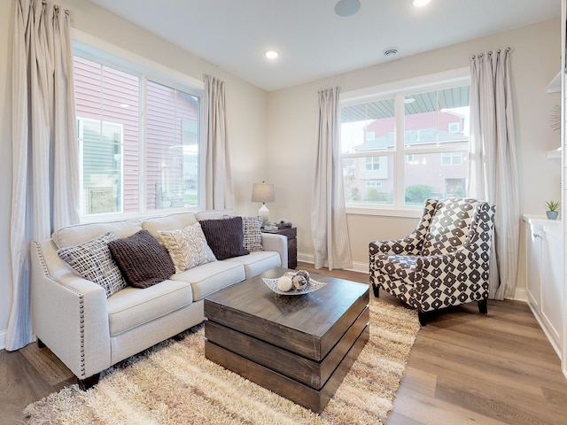 living room with light hardwood / wood-style flooring