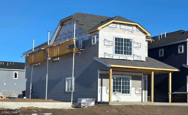 back of house featuring covered porch