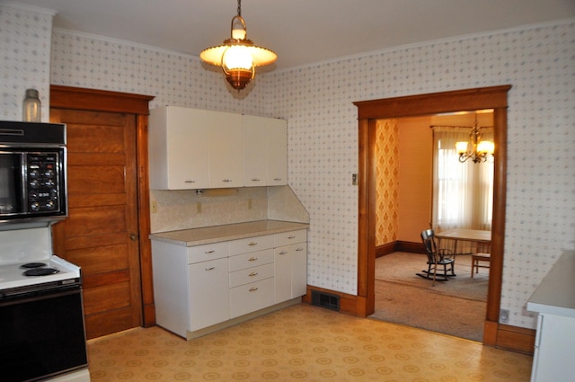 410 5th St, Montevideo, MN 56265 - kitchen featuring electric stove, a chandelier, wallpapered walls, white cabinetry, and hanging light fixtures