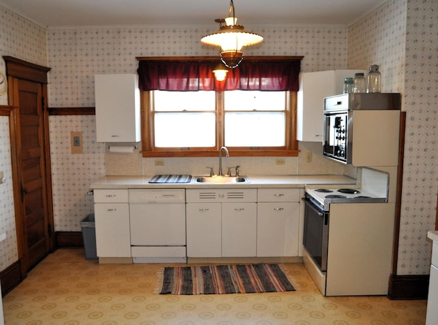 410 5th St, Montevideo, MN 56265 - kitchen with white appliances, wallpapered walls, ornamental molding, light countertops, and white cabinetry