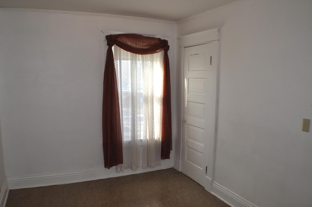 410 5th St, Montevideo, MN 56265 - empty room featuring dark carpet and baseboards