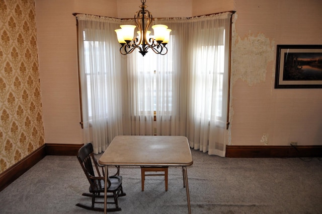410 5th St, Montevideo, MN 56265 - dining area with wallpapered walls, a chandelier, carpet flooring, and plenty of natural light