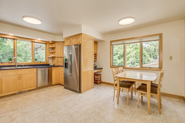 1755 Glenview Ave, Arden Hills, MN 55112 - kitchen featuring appliances with stainless steel finishes, a sink, open shelves, and dark countertops