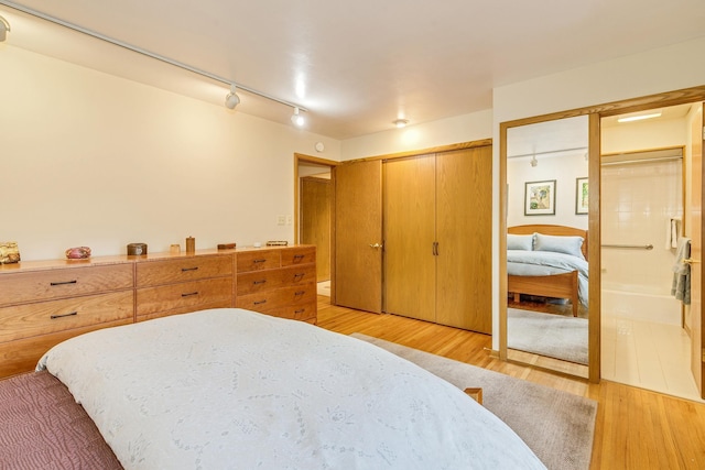 1755 Glenview Ave, Arden Hills, MN 55112 - bedroom featuring light wood-type flooring and rail lighting
