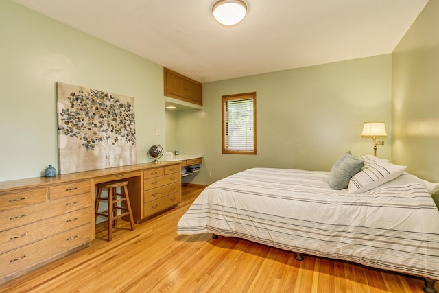 1755 Glenview Ave, Arden Hills, MN 55112 - bedroom featuring light wood-style flooring and an office area