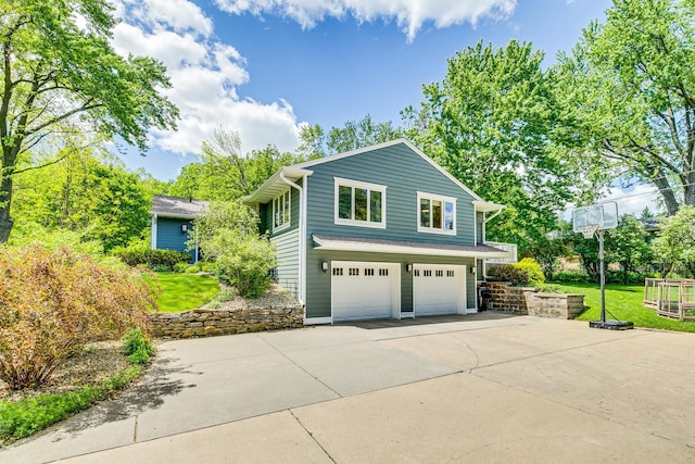 1755 Glenview Ave, Arden Hills, MN 55112 - view of side of property featuring a garage, concrete driveway, and a lawn