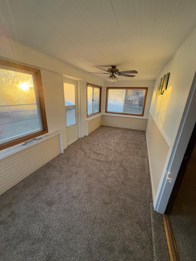 interior space featuring ceiling fan