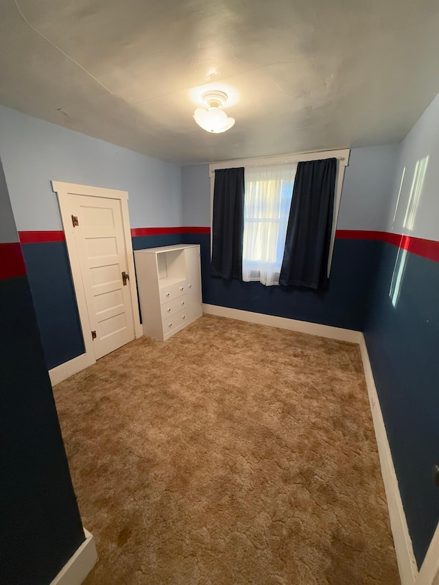 unfurnished bedroom with carpet