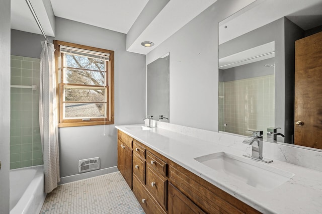 bathroom featuring tile patterned floors, vanity, and shower / tub combo