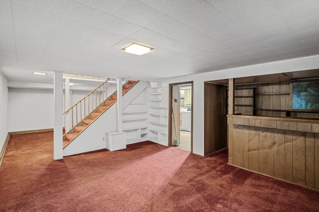 basement featuring washer / clothes dryer and carpet