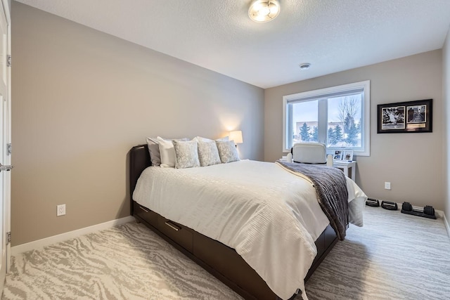 carpeted bedroom with a textured ceiling