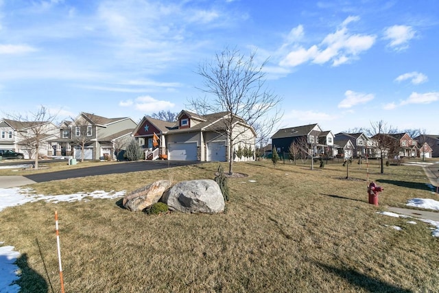 view of front facade featuring a front yard and a garage