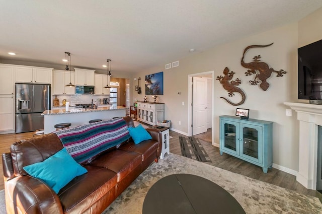 living room with dark hardwood / wood-style floors