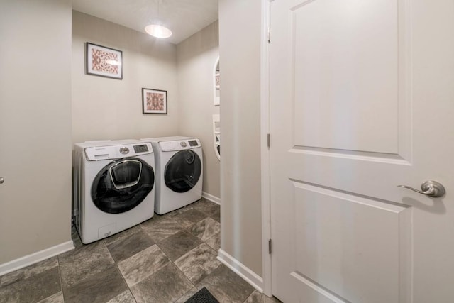 clothes washing area featuring independent washer and dryer