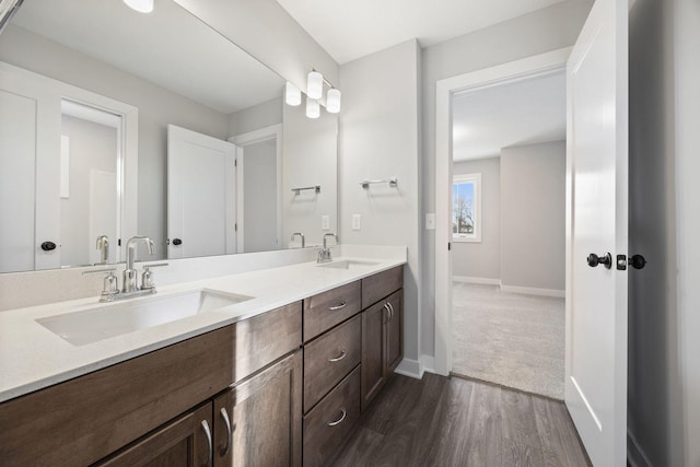 bathroom featuring hardwood / wood-style floors and vanity