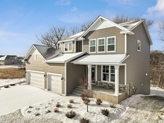 view of front of house with a porch and a garage