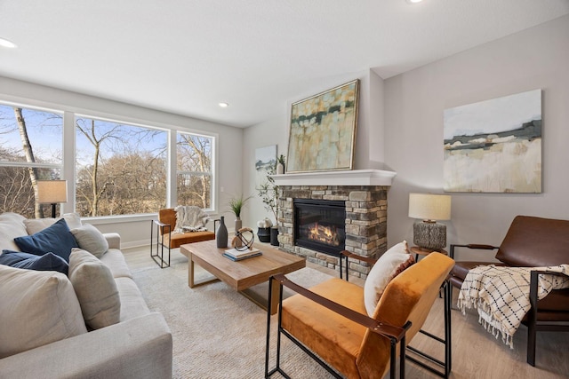 carpeted living room featuring a fireplace