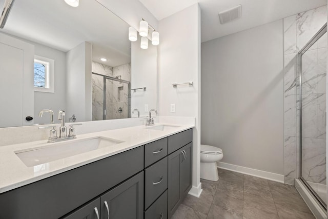 bathroom featuring walk in shower, vanity, and toilet