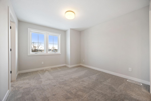 unfurnished room featuring carpet floors