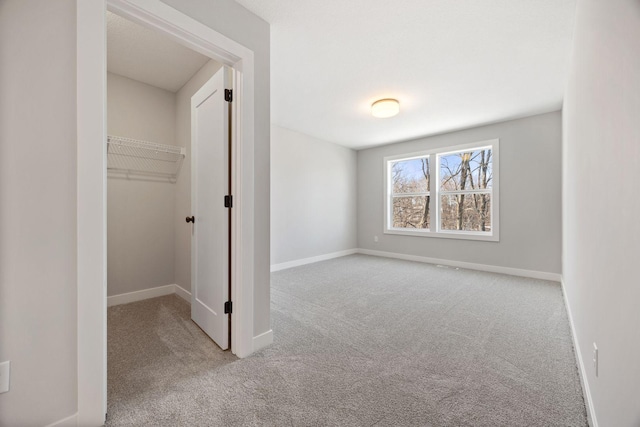 interior space featuring a closet and light carpet