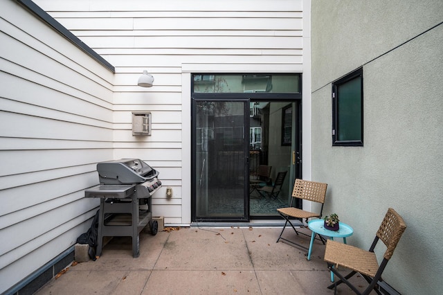 entrance to property featuring a patio