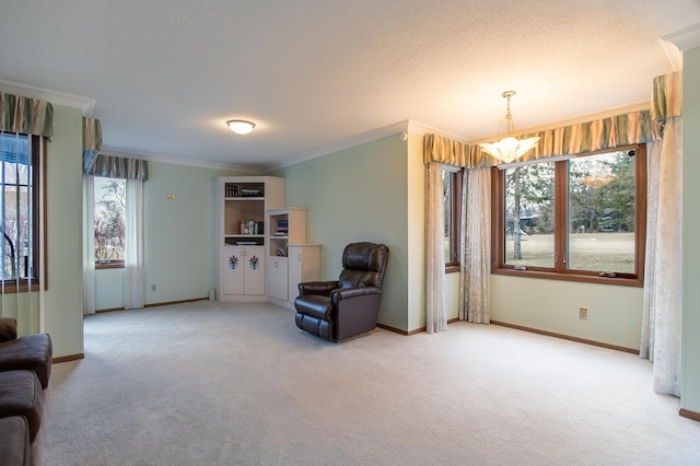 sitting room featuring a chandelier, carpet floors, and ornamental molding