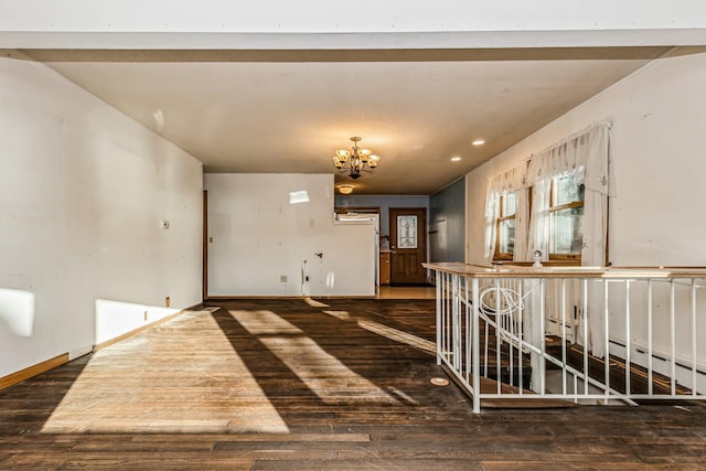 interior space with dark hardwood / wood-style flooring and an inviting chandelier