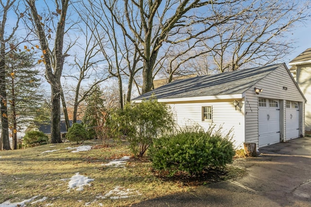 exterior space featuring an outdoor structure and a garage