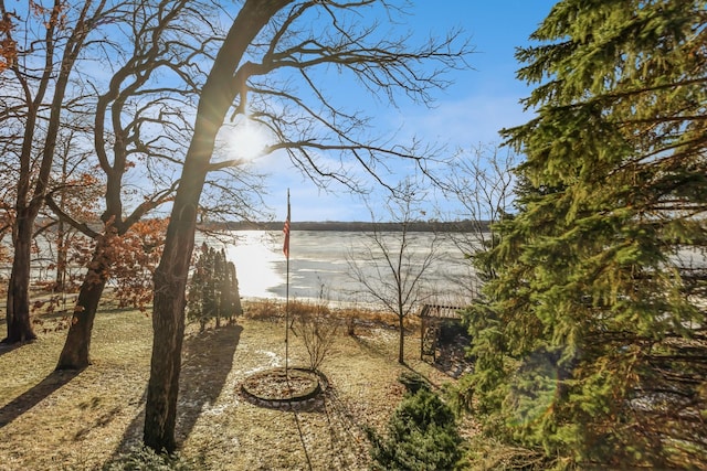 view of property exterior featuring a water view