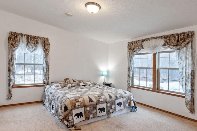 carpeted bedroom with a textured ceiling