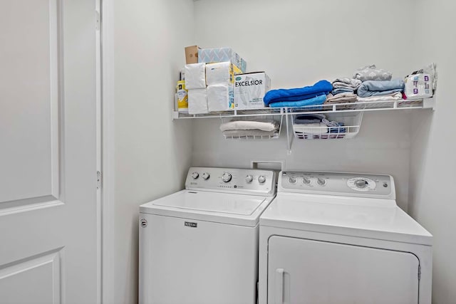 washroom with independent washer and dryer