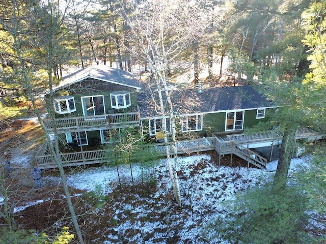 back of house with a wooden deck