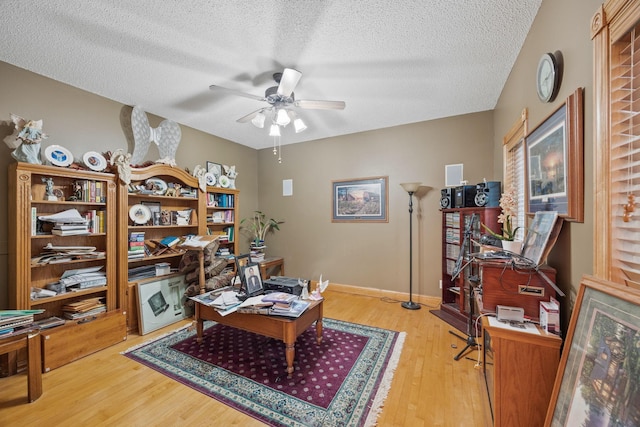 3078 70th St SW, Waverly, MN 55390 - home office featuring a ceiling fan, wood finished floors, a textured ceiling, and baseboards