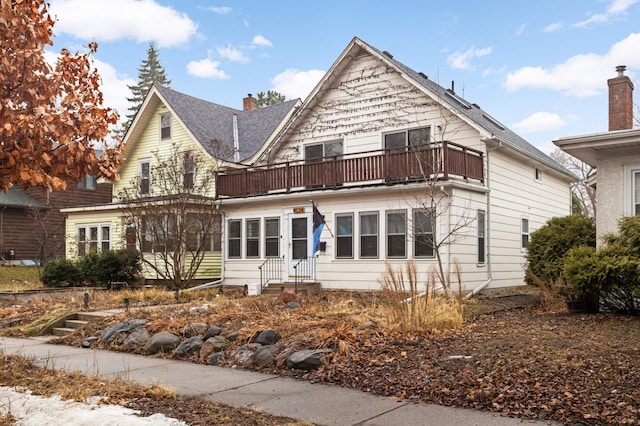 view of front of property with a balcony