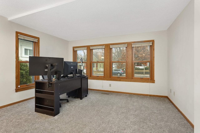 office area with light carpet and a textured ceiling