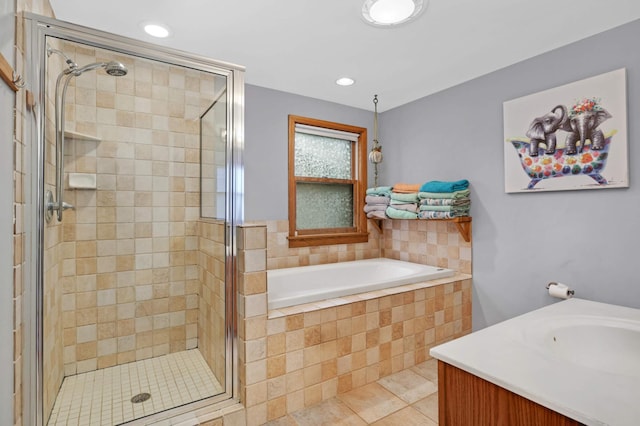 bathroom with vanity, tile patterned floors, and independent shower and bath