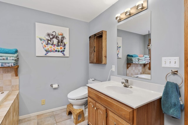 bathroom featuring tile patterned floors, vanity, toilet, and tiled tub