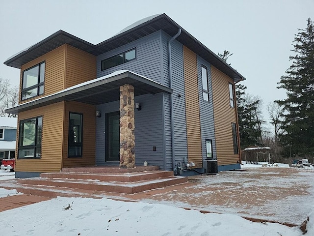 view of front facade with cooling unit