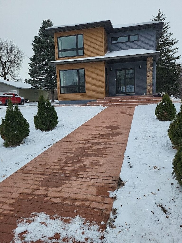 view of snow covered property